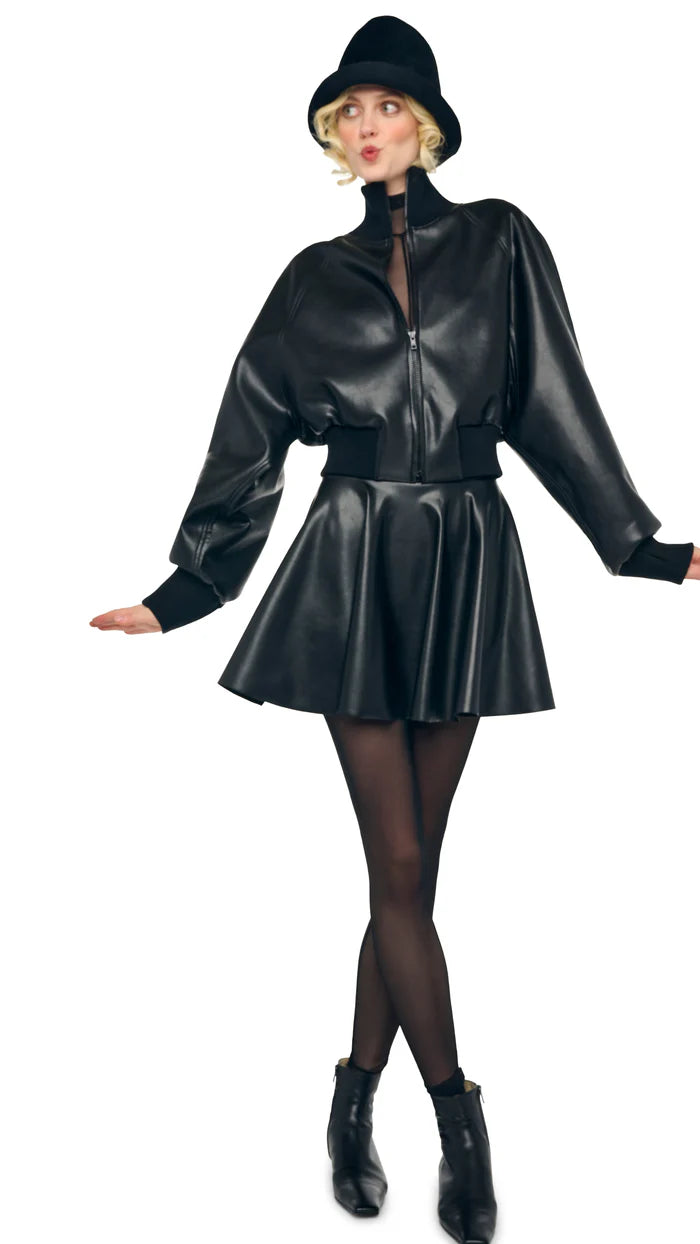 Norma Kamali pleated mini skirt in faux leather with flared silhouette and pull-on fit