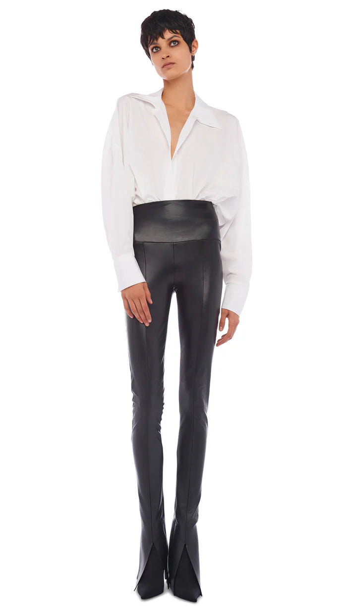Slim-fit high-waisted vegan leather leggings with center slit detail by Norma Kamali
