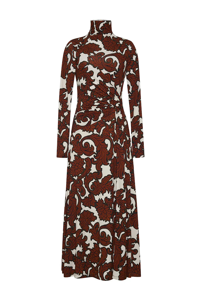 A long sleeve, turtleneck midi dress with an asymmetric draped paneled bodice, ruched at the waist for a flattering fit-and-flare silhouette. Features lean sleeves, a center back seam with hidden zipper and hook-and-eye closure, and an allover print. Unlined for a sleek look.