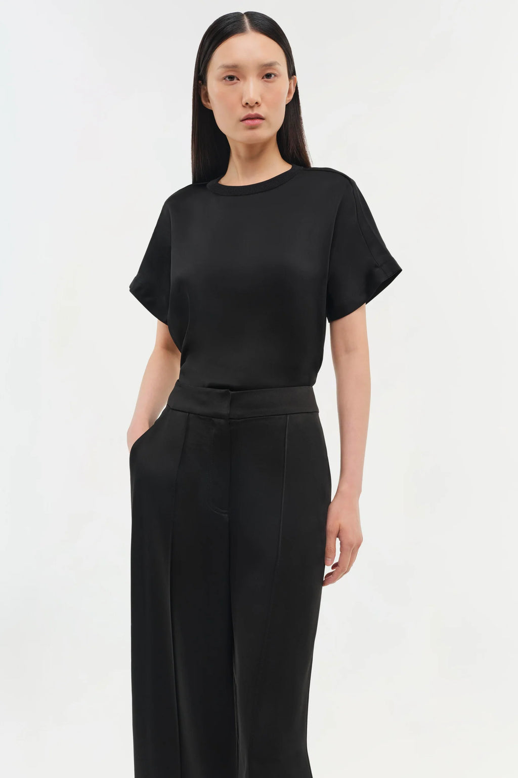 Model wearing Simkhai The Addy T-Shirt in Midnight with classic round neckline and relaxed fit