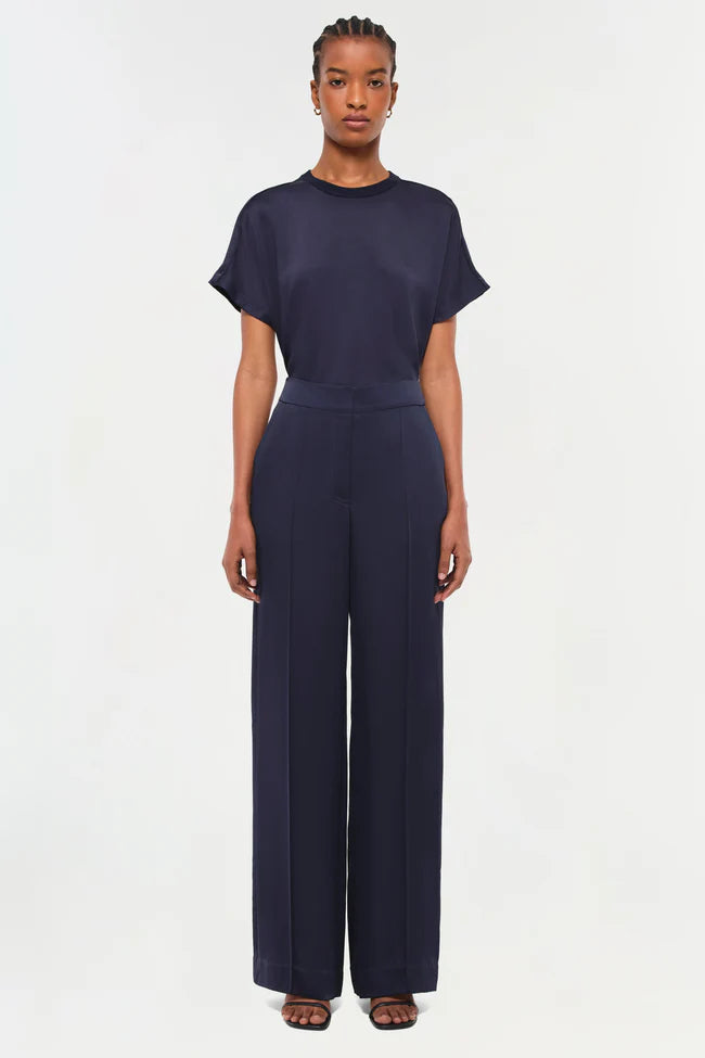 Model wearing Simkhai The Addy T-Shirt in Midnight with classic round neckline and relaxed fit