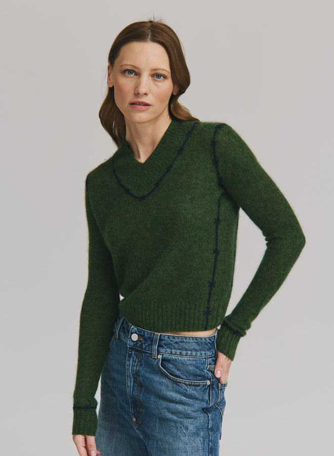 Autumn Cashmere fitted V-neck sweater in camo colorway with contrast navy embroidered stitching.