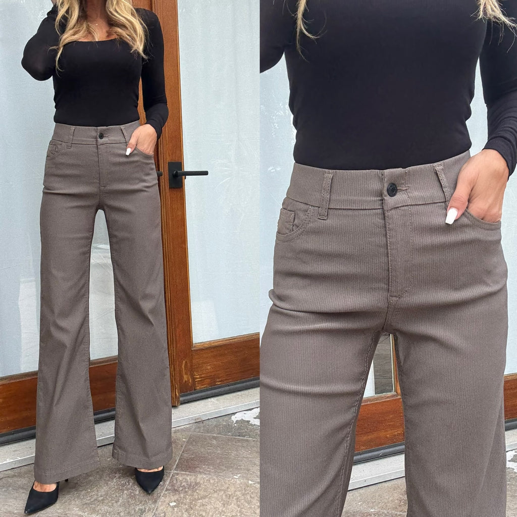 Close-up of Bevy Flog Amy pants elastic waistband with belt loops and button-zipper closure