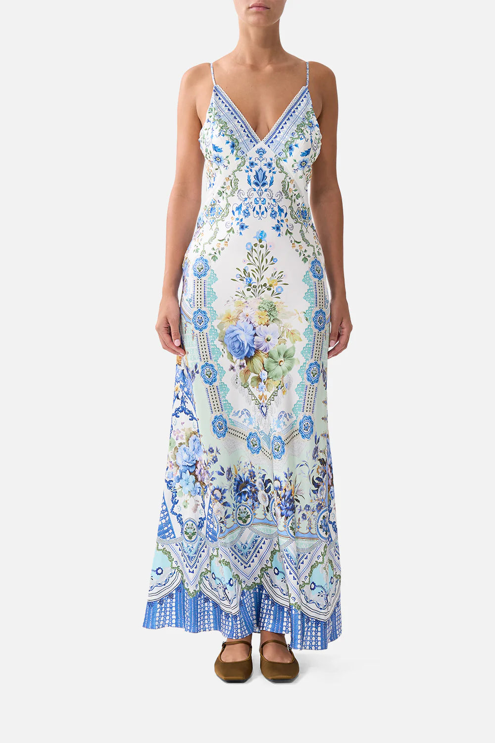 Full-length silk bias-cut slip dress with a deep V-neck and low back, featuring an exclusive homespun-inspired print, adjustable straps, and delicate crystal embellishments that add a luminous touch.