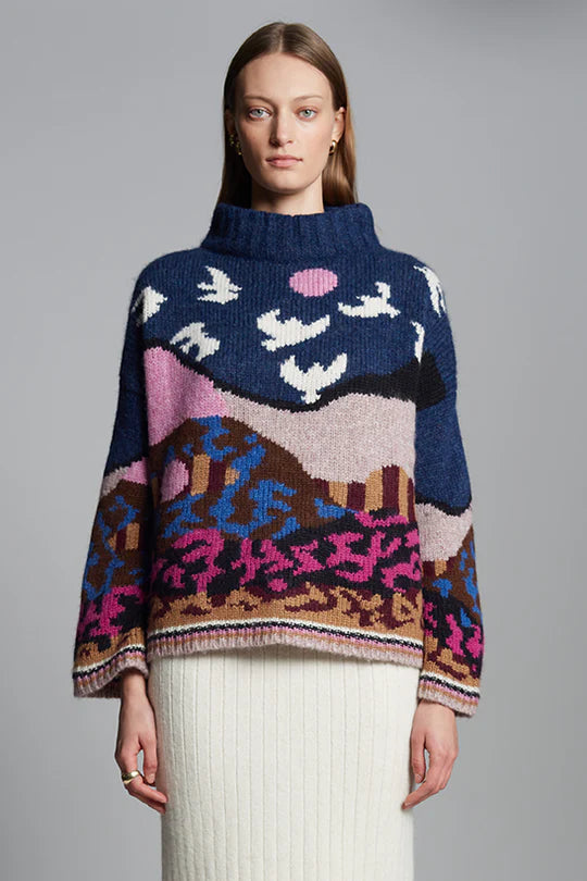 Eleven Six Caroline Sweater in alpaca blend with graphic intarsia landscape design, chunky double mock neck, and striped rib cuffs and hem, handmade in Peru in collaboration with artist Caroline Burdett.