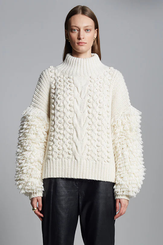 Eleven Six Bella Sweater in chunky alpaca blend with popcorn and cable knit, fringe sleeve detail, mock neck, and boxy fit, handmade in Peru.