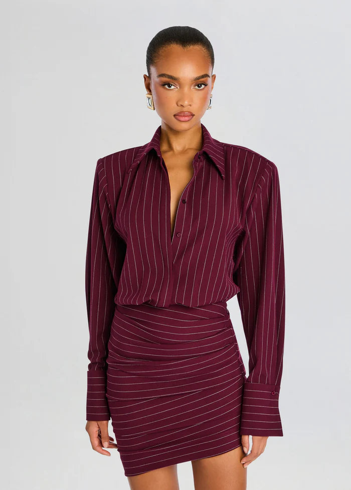 Model wearing the Retrofête Narine Dress in Port – bodycon wool-blend dress with a flattering drape, perfect for day-to-night wear.