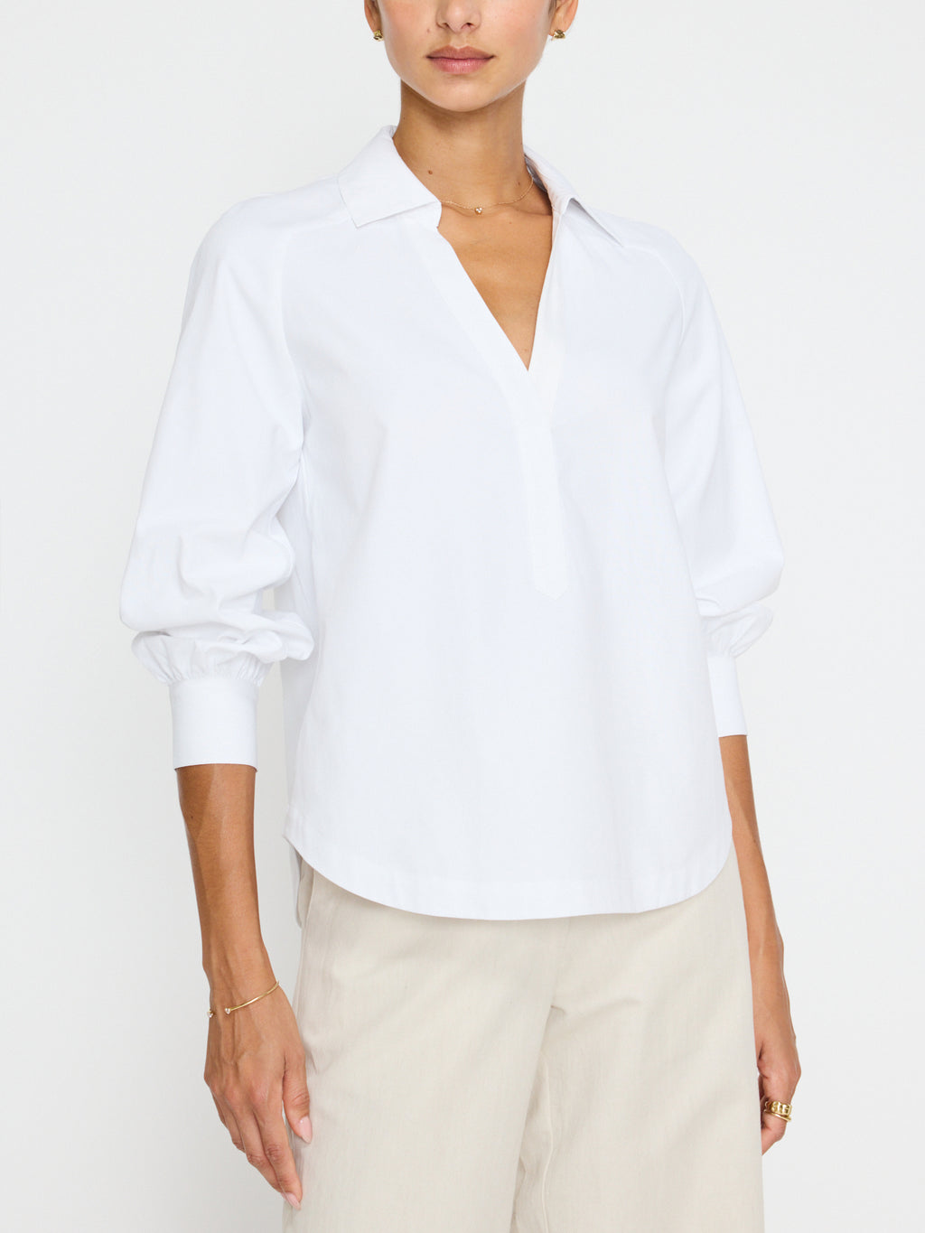 Brochu Walker Emilia Top, relaxed fit top, popover silhouette, collared top, deep v neckline, grosgrain detailing, saddle shoulders, shirred sleeves, button cuffs, curved hem top, polyester cotton top, women’s blouse, stylish top, versatile top.