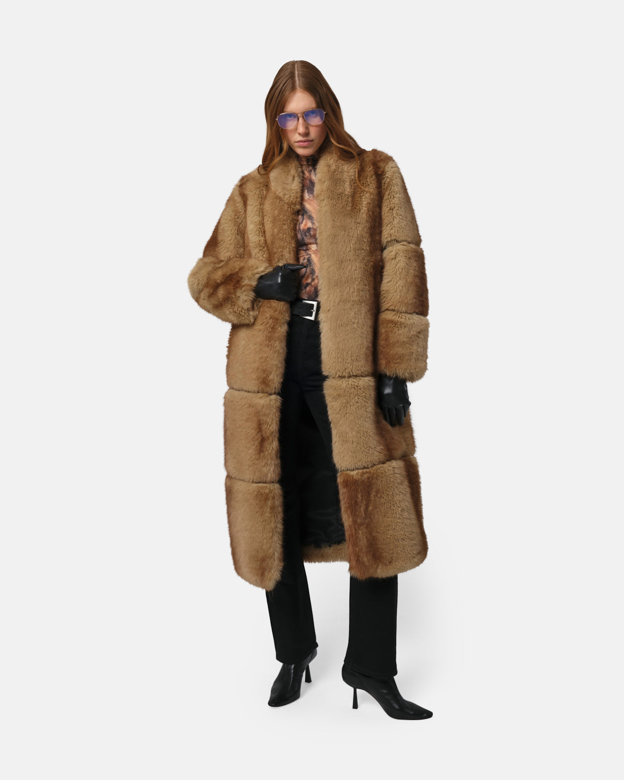 Model wearing Apparis Sylke Jacket in longline faux fur with stand collar, hook-and-eye closure, and tonal faux leather accents; sustainable outerwear made from 100% recycled polyester