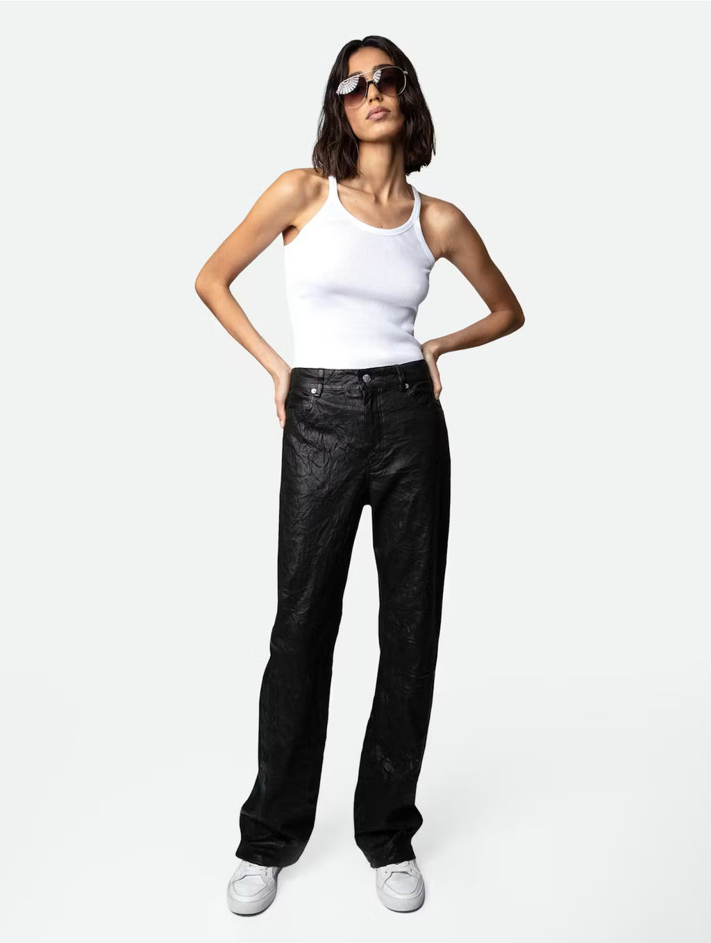 Black Zadig & Voltaire women’s flared leather pants with signature crinkled texture, mid-rise waist, front flap pockets, back patch pockets, and tailored flared legs