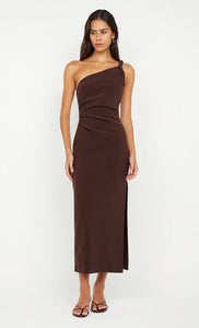 Model wearing the Bec + Bridge Ariven Asym Midi Dress in Dark Chocolate, featuring an asymmetric neckline with twist strap, fitted silhouette, and side leg split.