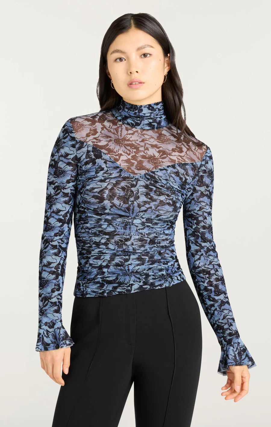 Women’s fine mesh turtleneck in deep cosmos blue, fitted silhouette with long sleeves, made from stretch polyester blend.