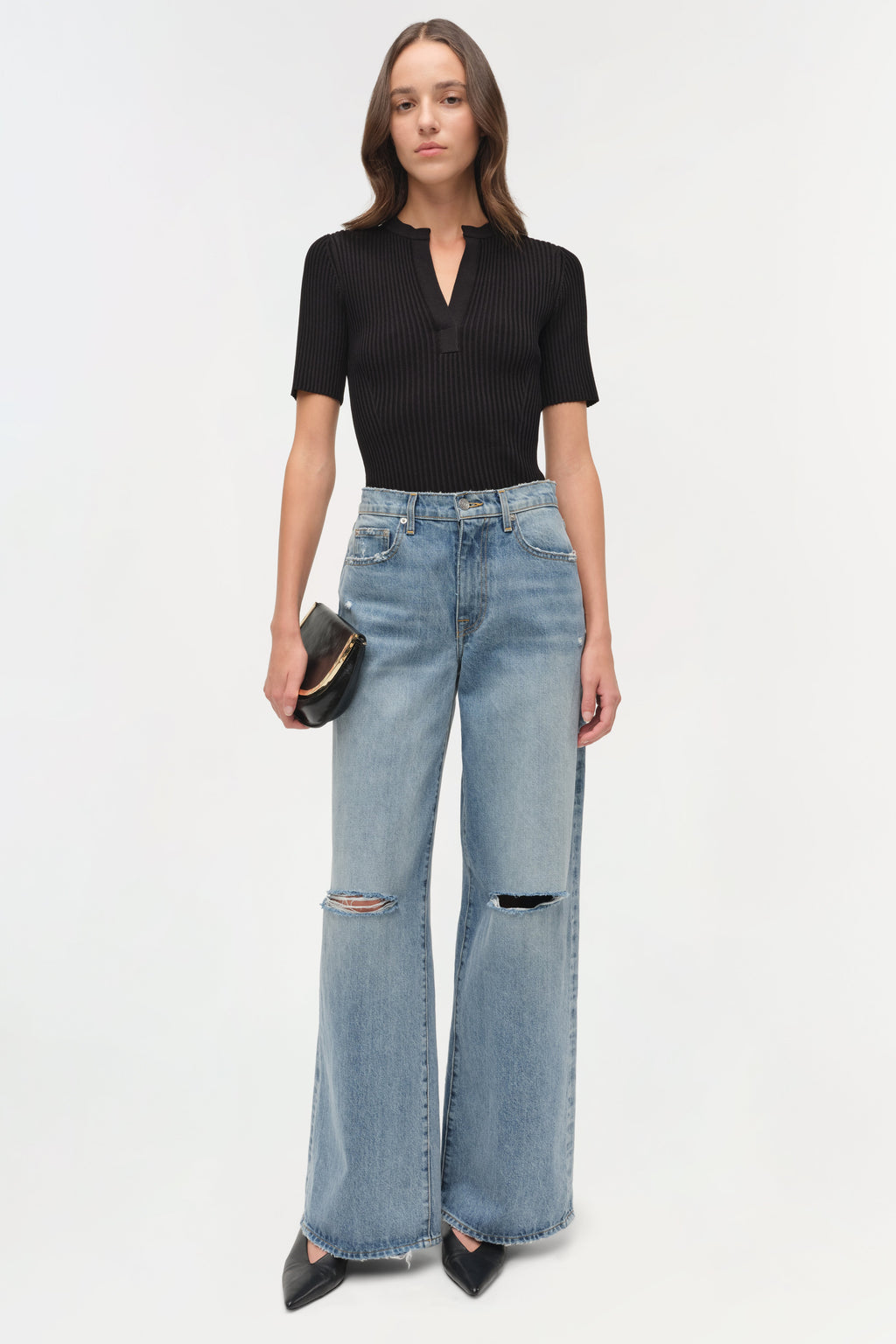 Simkhai Willoughby Jeans featuring a high-rise waist, full-length wide leg, and distressed knees with a zipper fly and button closure, crafted from premium cotton denim.