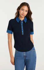 Load image into Gallery viewer, Model wearing the Cinq à Sept Jaden Top, a short sleeve denim-combo pullover with a collared neckline, half button front, contrast stitching, and a fitted silhouette
