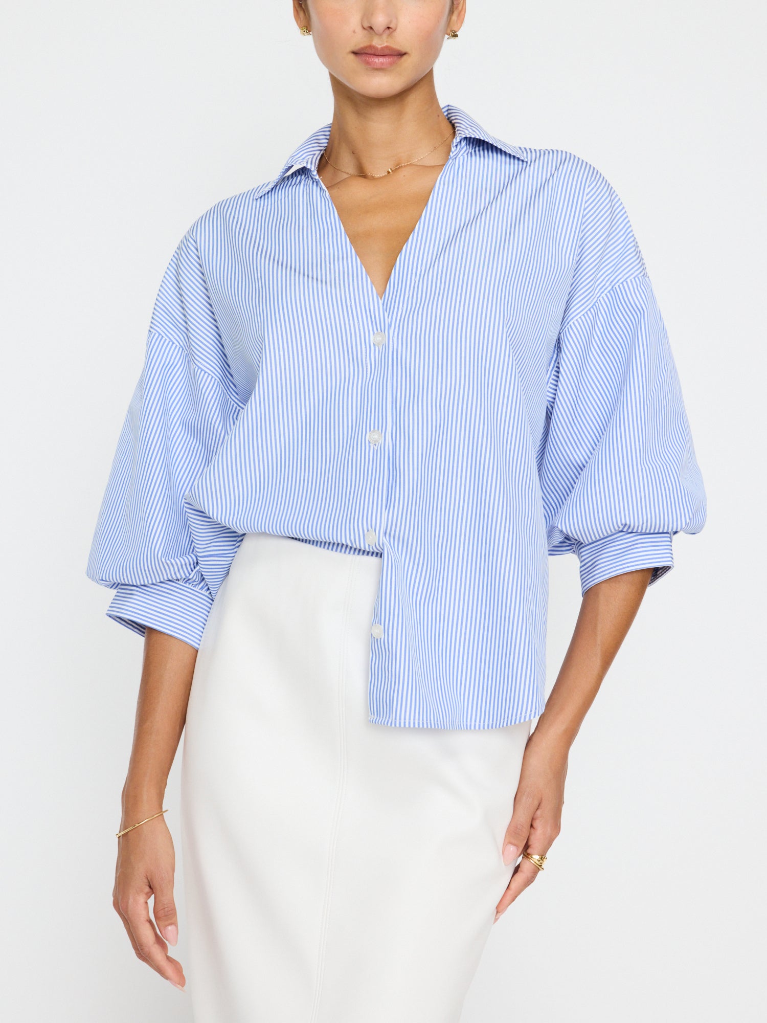 Brochu Walker Kate Top, oxford blue top, relaxed fit top, collared v-neck top, button front top, elbow-length sleeves, blouson sleeves, scooped shirttail hem, polyester cotton top, women’s button top, stylish blouse, versatile top.