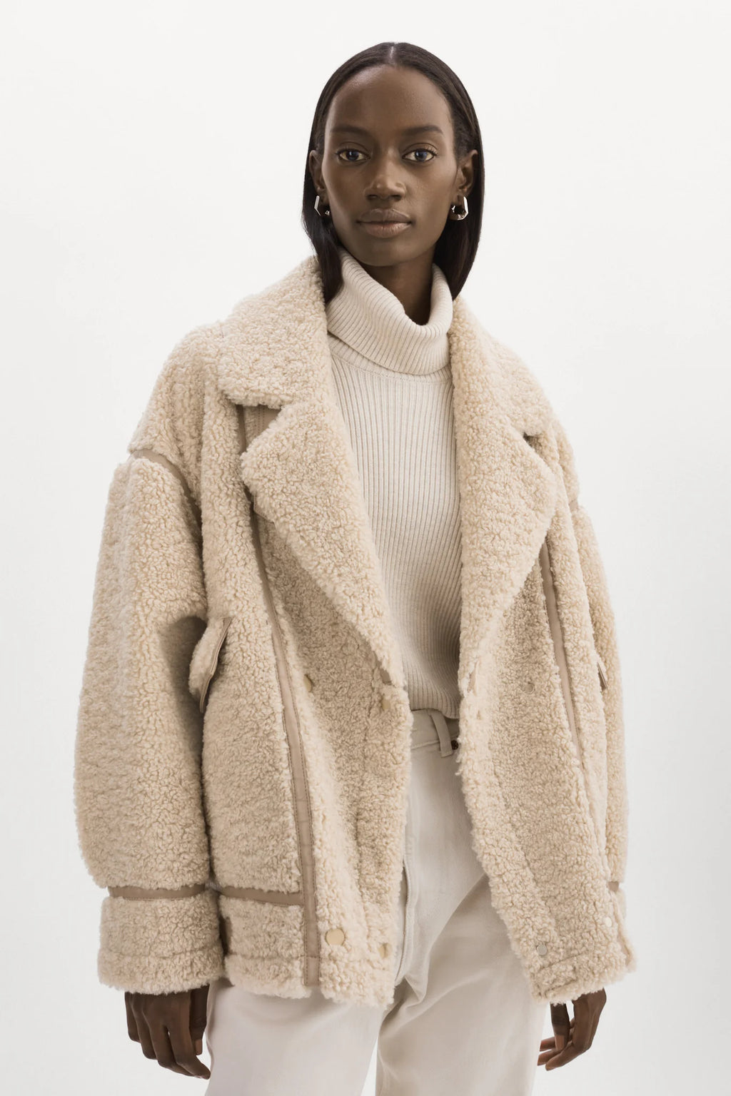 Women’s winter jacket in plush faux shearling with notch collar and buckle strap