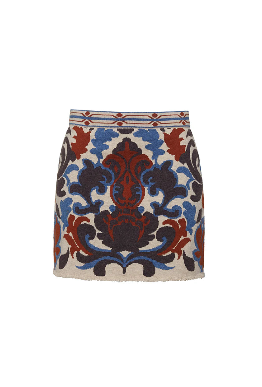 A mini-length A-line skirt in jacquard knit with an elasticated waistband and mini fringe trim detail at the hem. Made from a blend of 55% extra fine merino wool and 45% cotton, this skirt is soft, breathable, and versatile. Perfectly paired with the matching Livi Jacket.