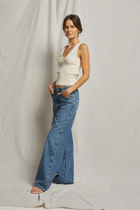 White ribbed V-neck tank top made from 95% cotton and 5% spandex, designed for a flattering fit and comfortable wear.