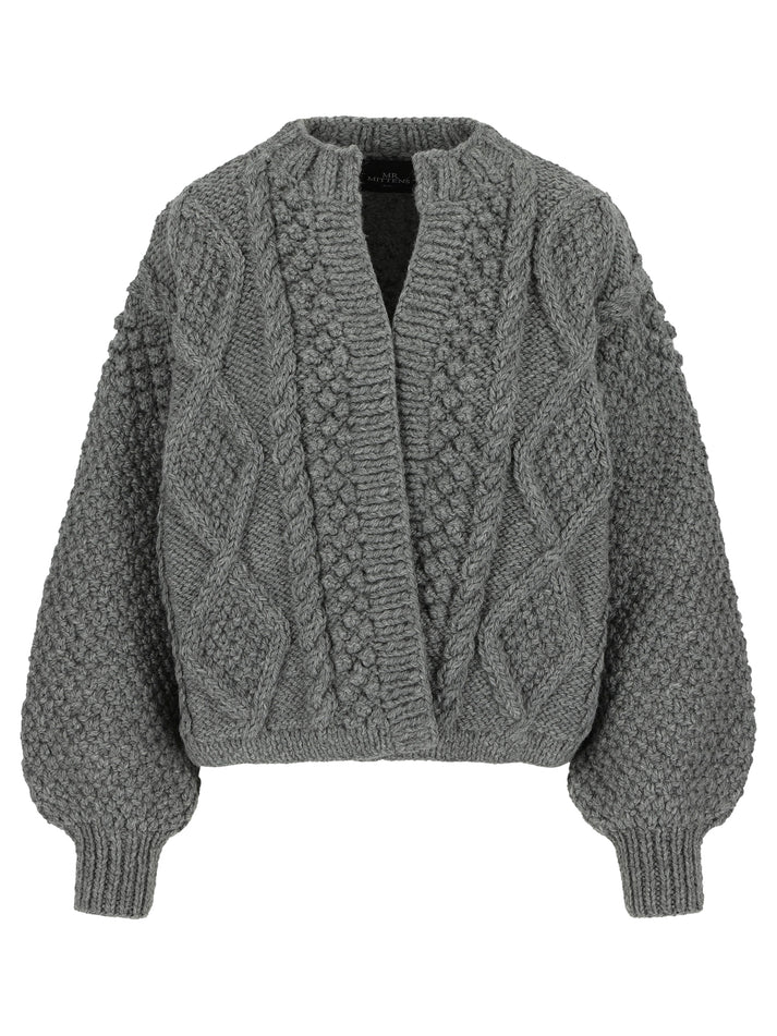 A soft, 100% wool cardigan featuring a unique stitching pattern and round neckline. The Kimmie Cardigan has an above-the-hips length and an open design without closures, offering a relaxed, effortless fit. Perfect for layering over any outfit, it combines timeless style with a contemporary silhouette