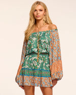 Load image into Gallery viewer, Ramy Brook Claudine off-the-shoulder dress featuring long blouson sleeves, a smocked elastic waist, and a patchwork paisley print in a romantic, bohemian silhouette
